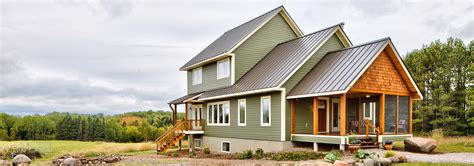 grey house with green metal roof|sage green farmhouse exterior.